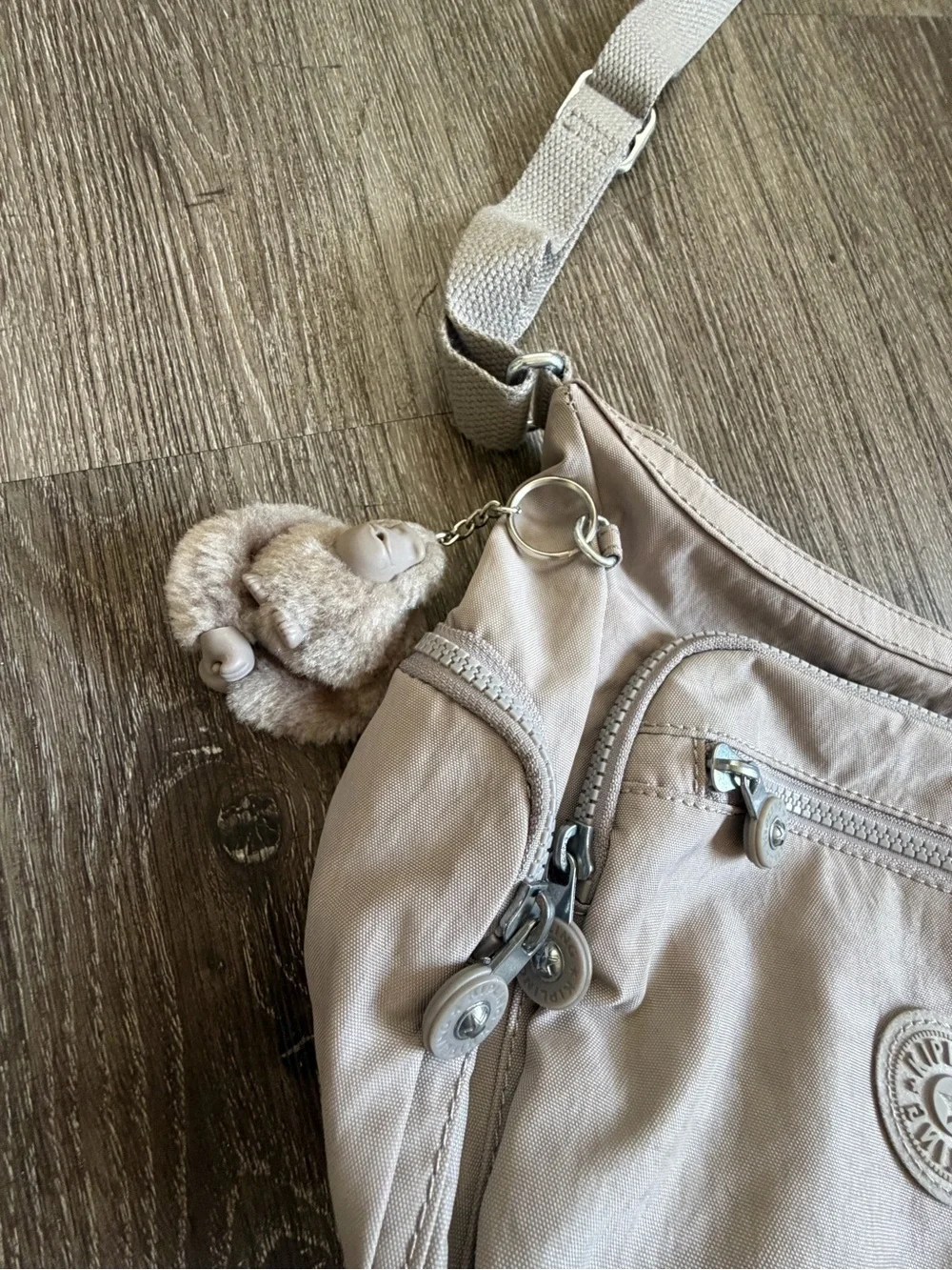 Kipling Light Beige Crossbody Bag with Multiple Zips